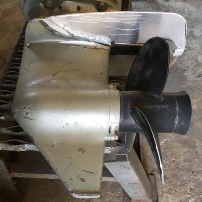 A close up of a boat propeller on a table.