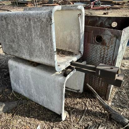 A stack of concrete blocks sitting on top of each other on the ground.
