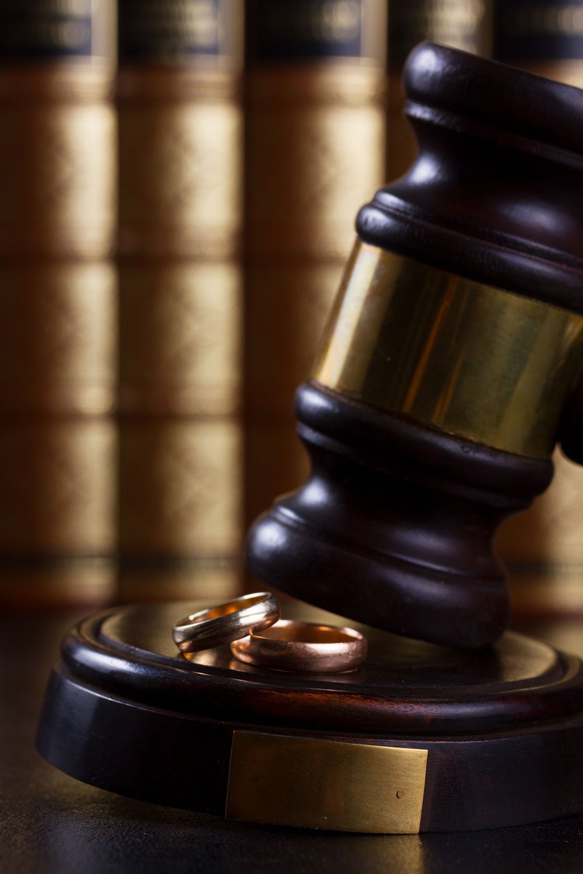 close up of law gavel with two rings, divorce concept