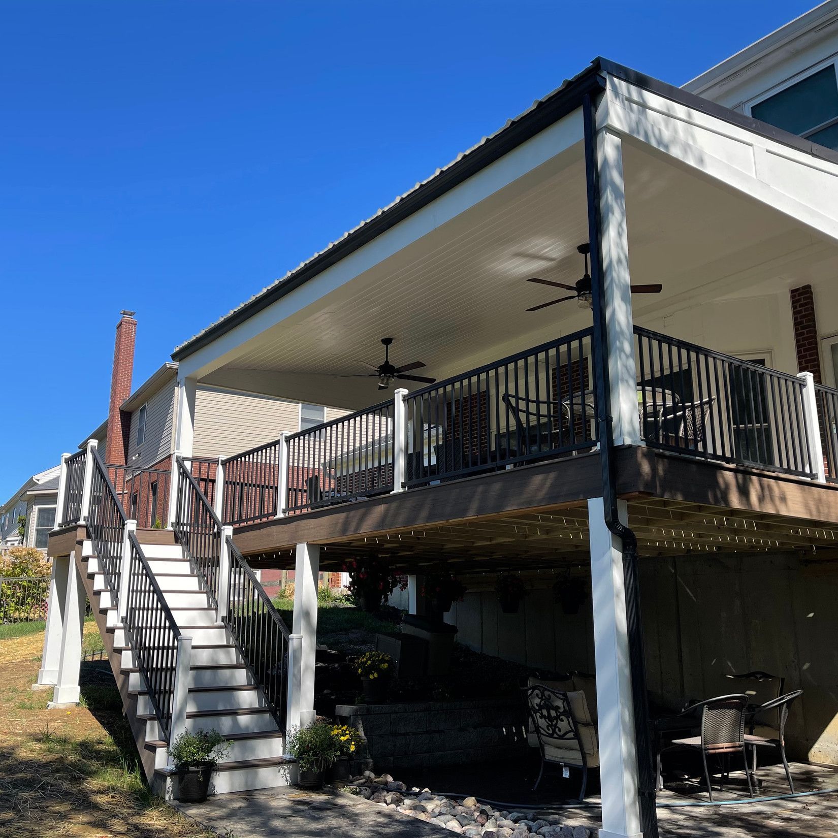 A large deck with stairs leading up to it