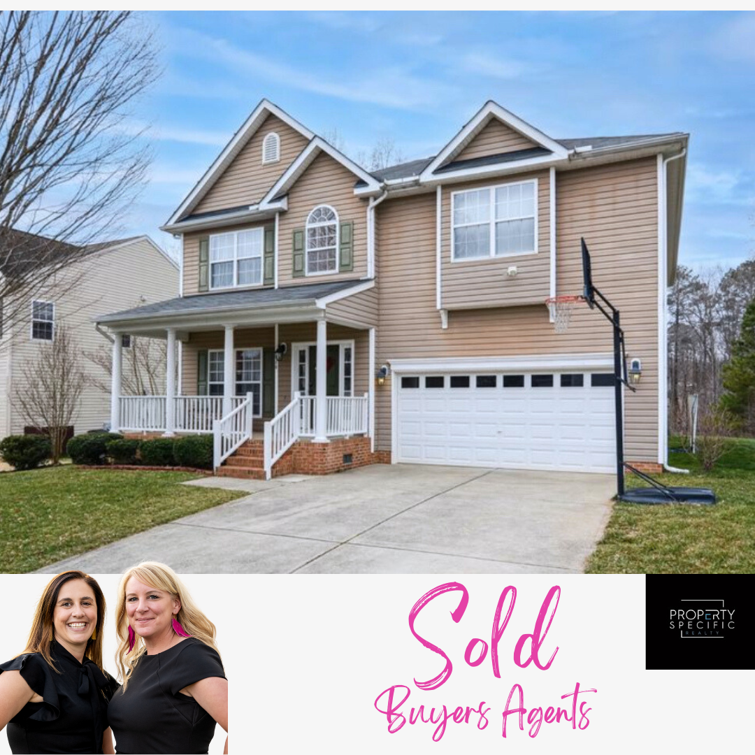 Two-story beige house with white trim;