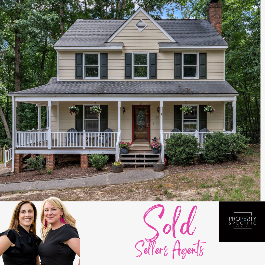 Two-story yellow house with a porch,