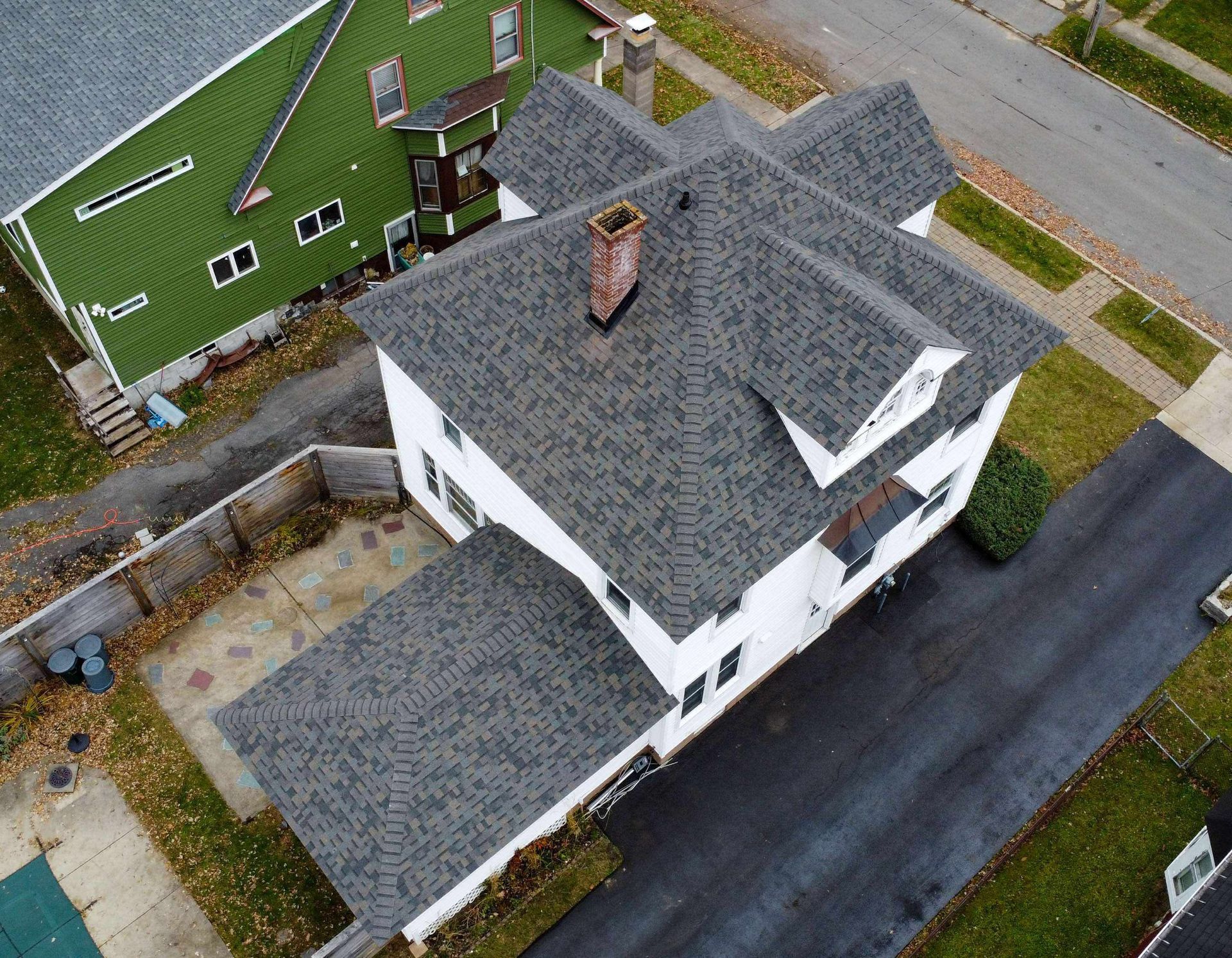 An aerial view of a house with a new roof
