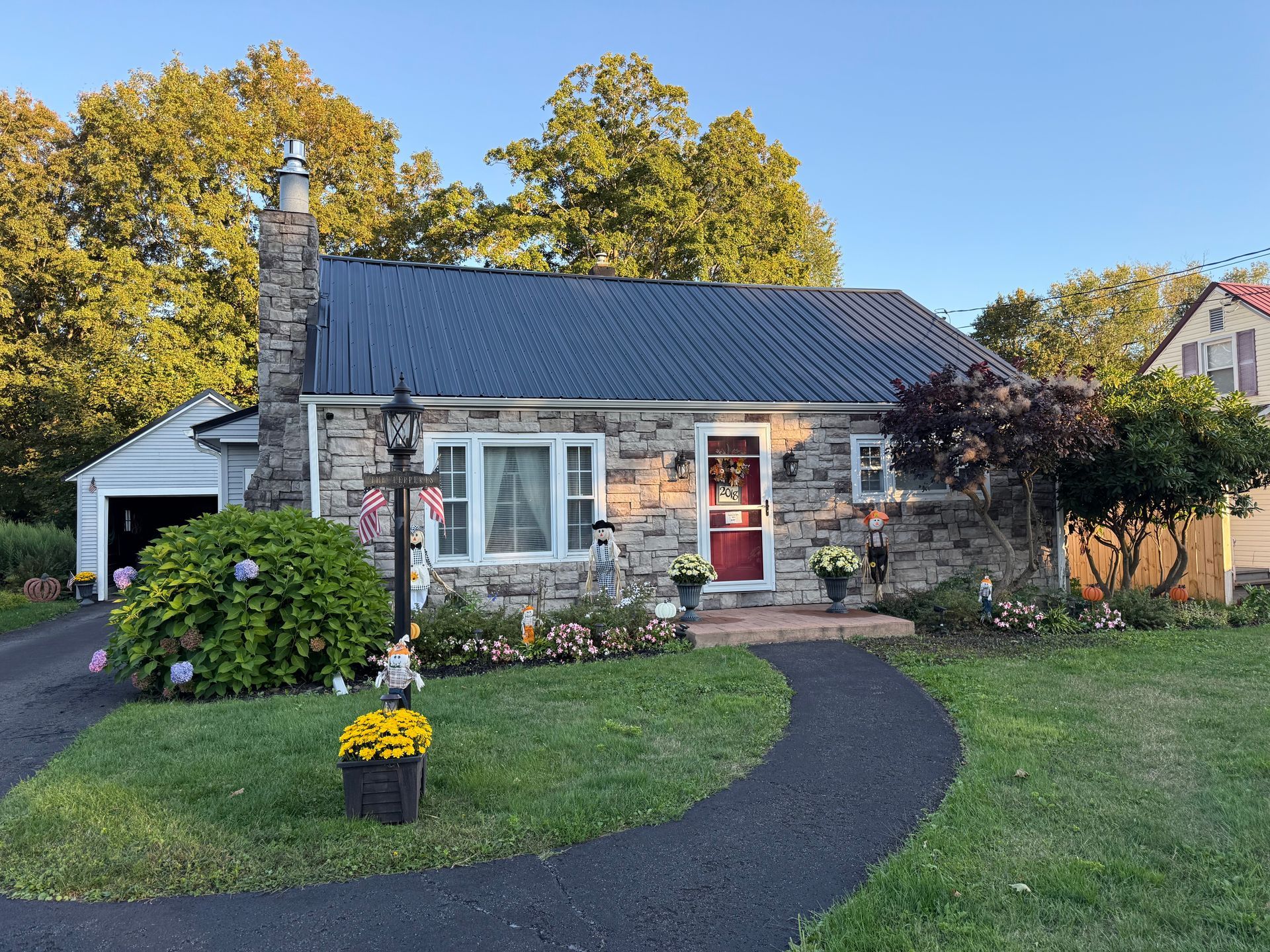 An aerial view of a house with a new red roof
