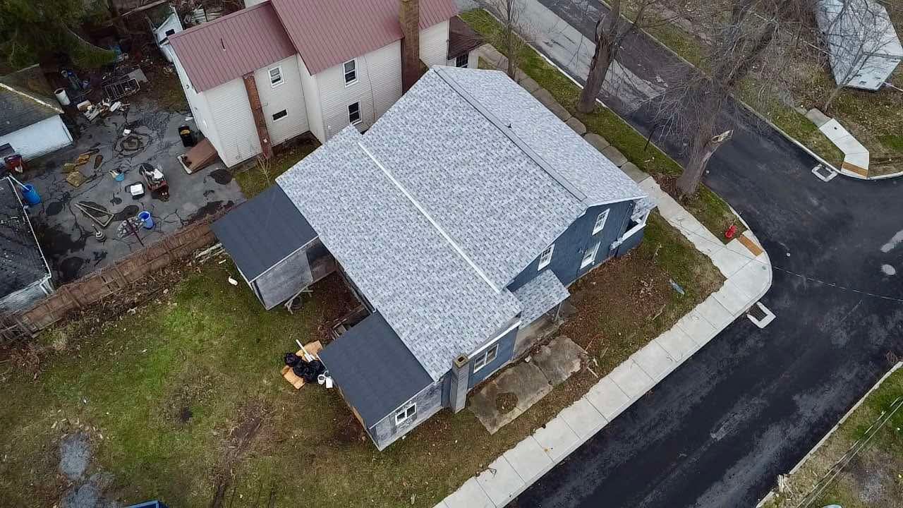 An aerial view of a house with a new roof