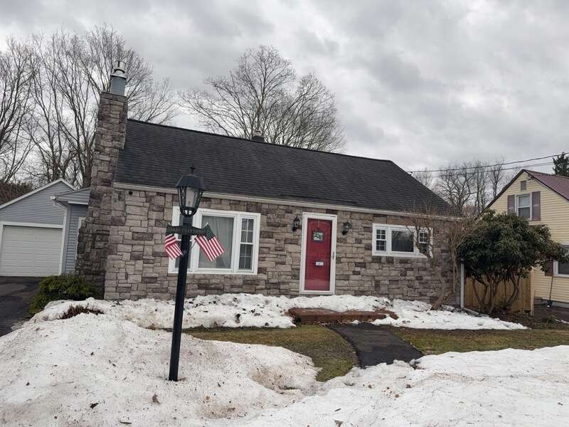 An aerial view of a house with an old roof