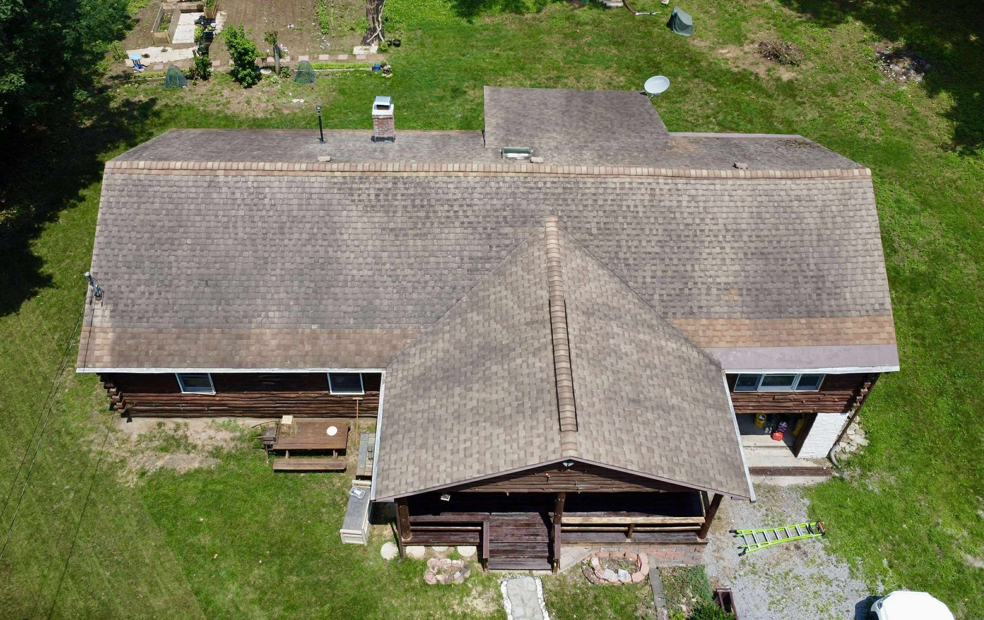 A white van is parked in front of a house
