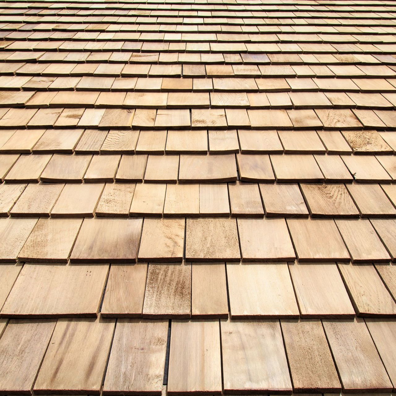 A close up of a wooden shingle roof