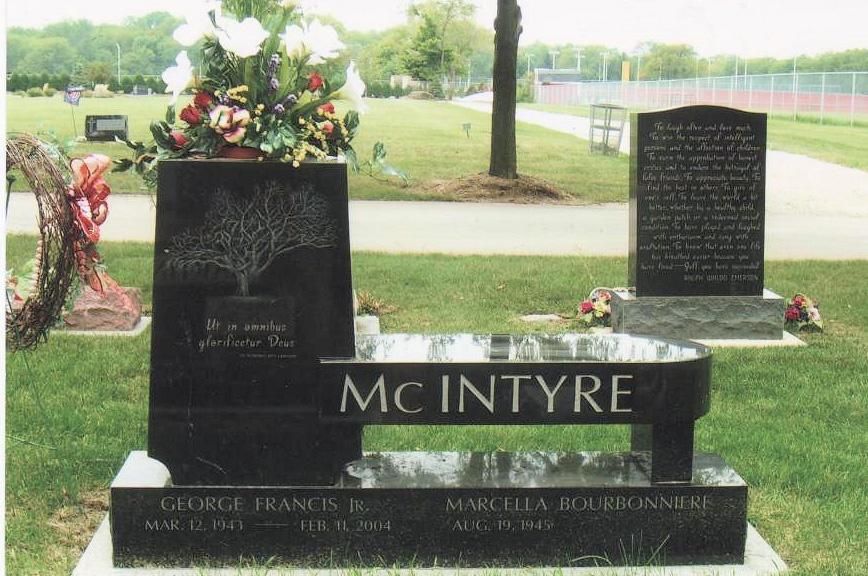 A black bench with the name mcentire written on it