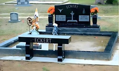 A cemetery with a bench that says ' eckert ' on it