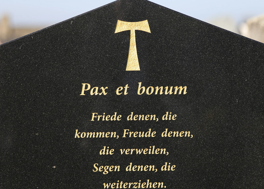 A cemetery filled with lots of graves and trees