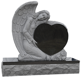 A statue of an angel with wings holding a heart