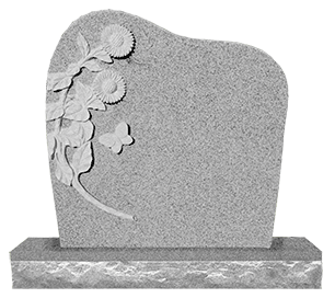 A gravestone with flowers and butterflies carved into it