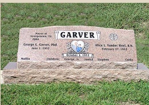 A gravestone for garver is sitting in the grass.