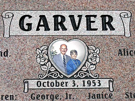 A gravestone for ben and may with a picture of the couple on it