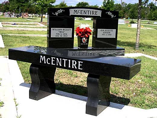 A black bench with the name mcentire written on it