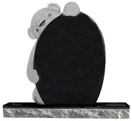 A black gravestone with a teddy bear on it