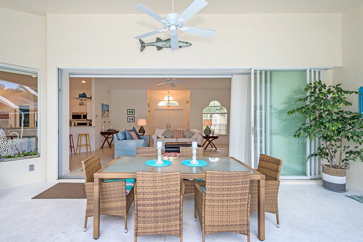 Lanai with outdoor dining area at Naples Lake View, Briarwood, Florida