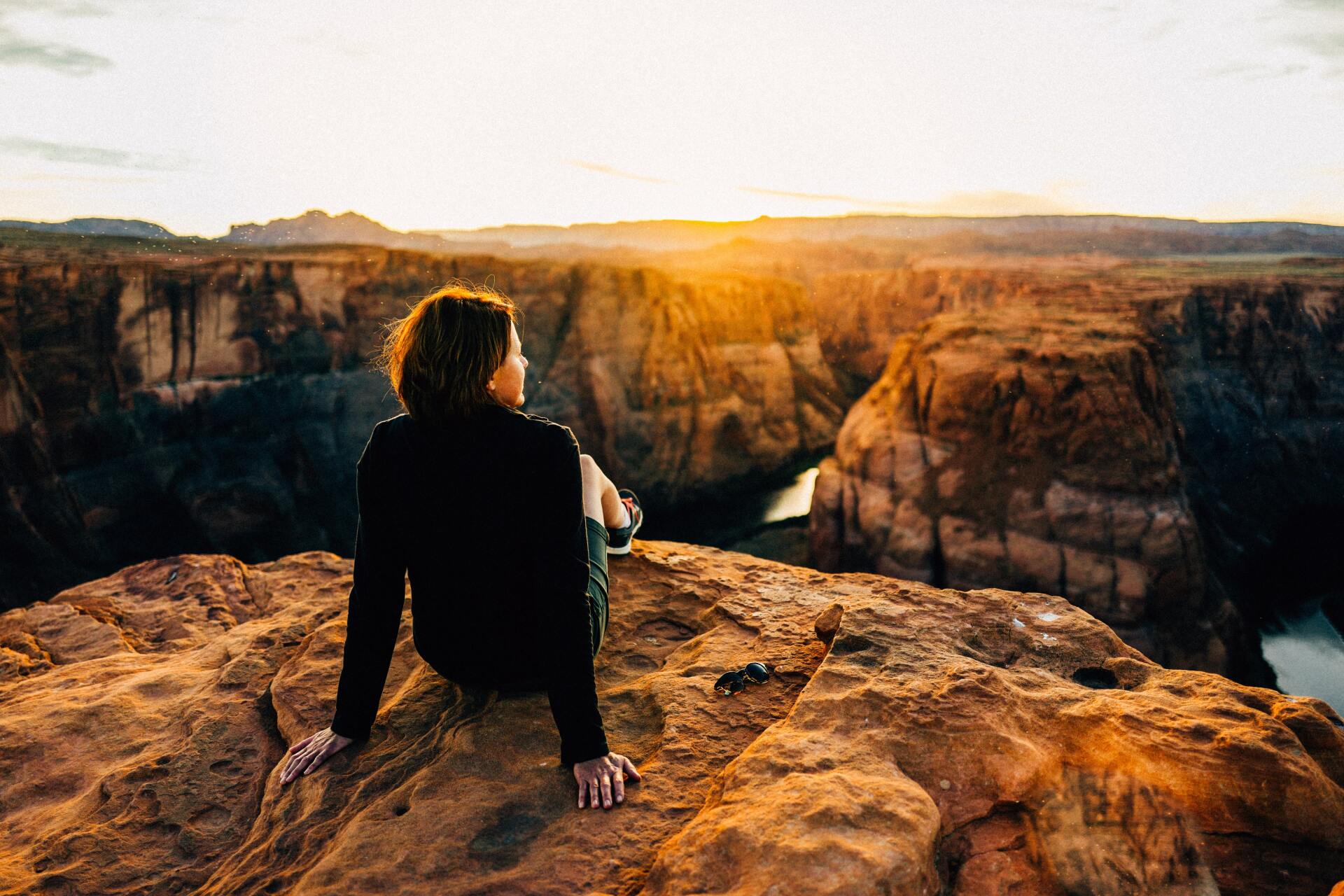 person reclining looking out over a valley