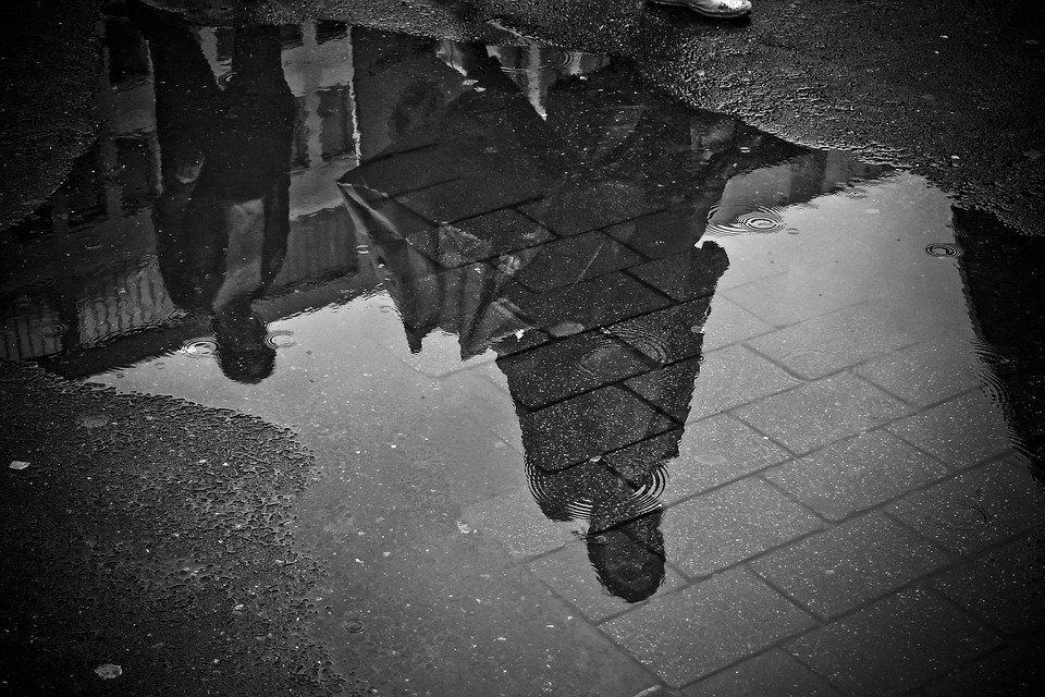rain puddle on pavement