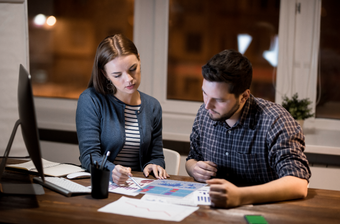 two people working on a strategic plan