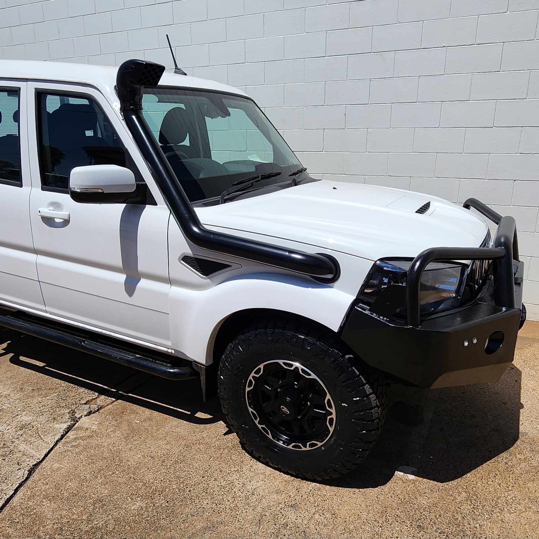 A White Ute With Snorkel — Rum City Exhaust Centre in Bundaberg Central, QLD