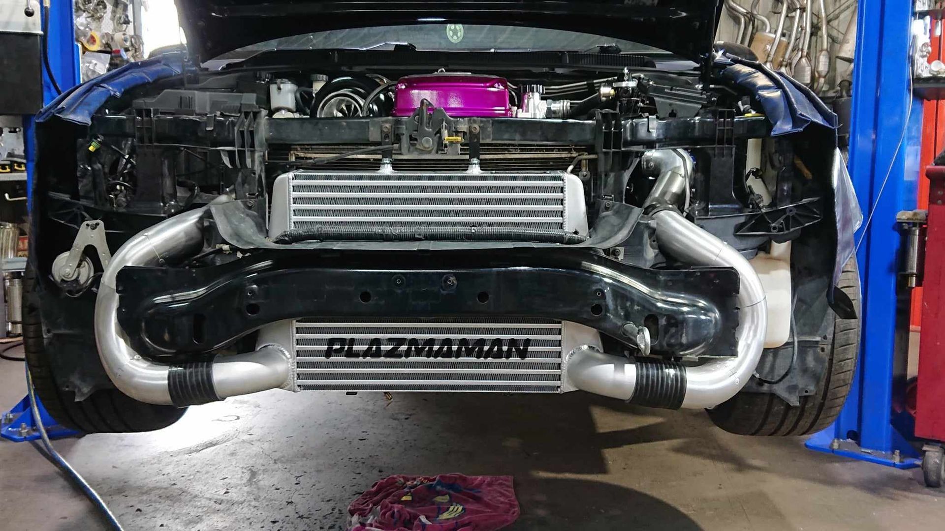 A Car with A Snorkel on The Side of It Is Parked in Front of A Building — Rum City Exhaust Centre in Bundaberg Central, QLD