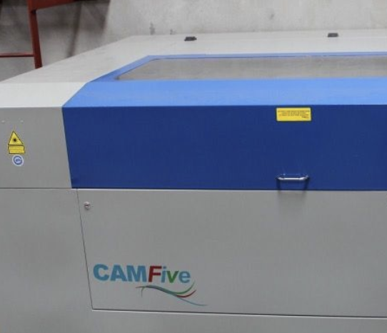 A camfive machine is sitting on a table