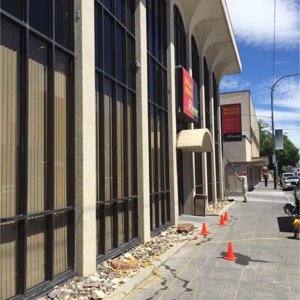 A sign on the side of a building that says ' united states postal service '