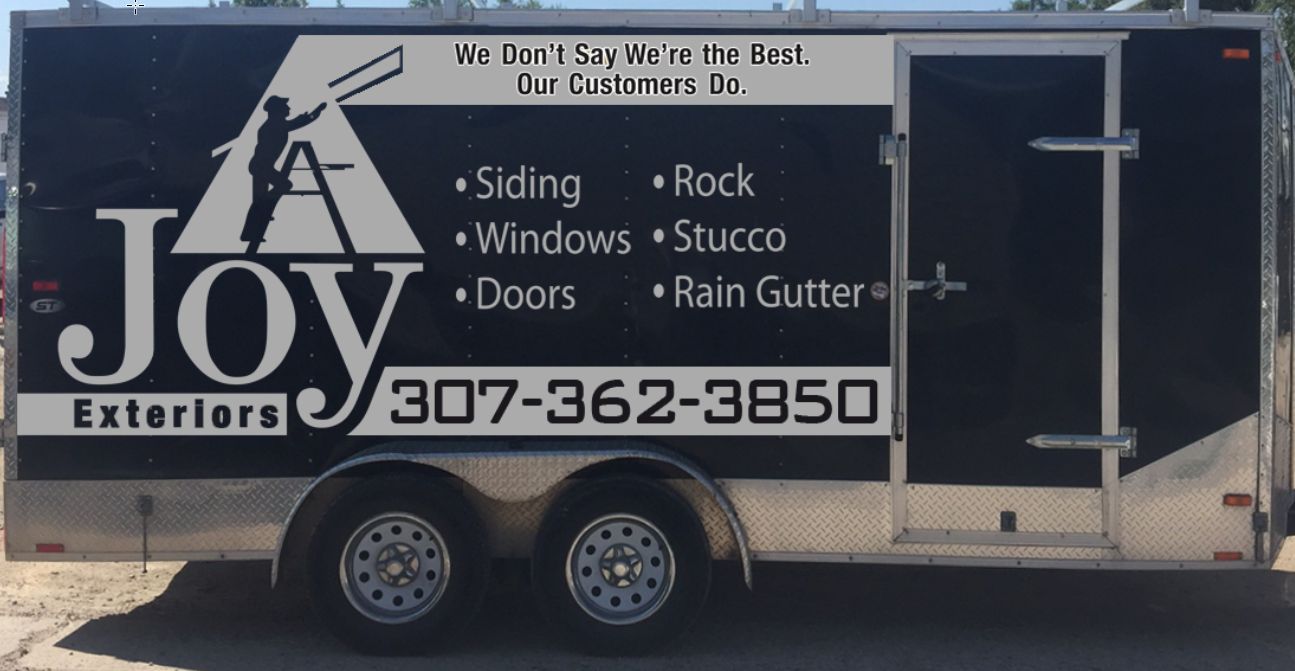 A trailer that says joy exteriors on it