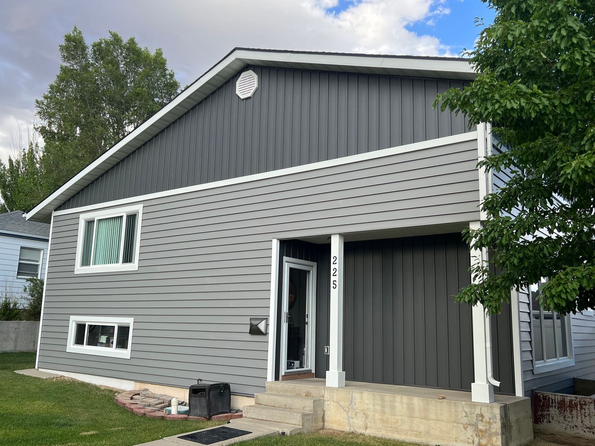 A house with a roof that has a window on it.