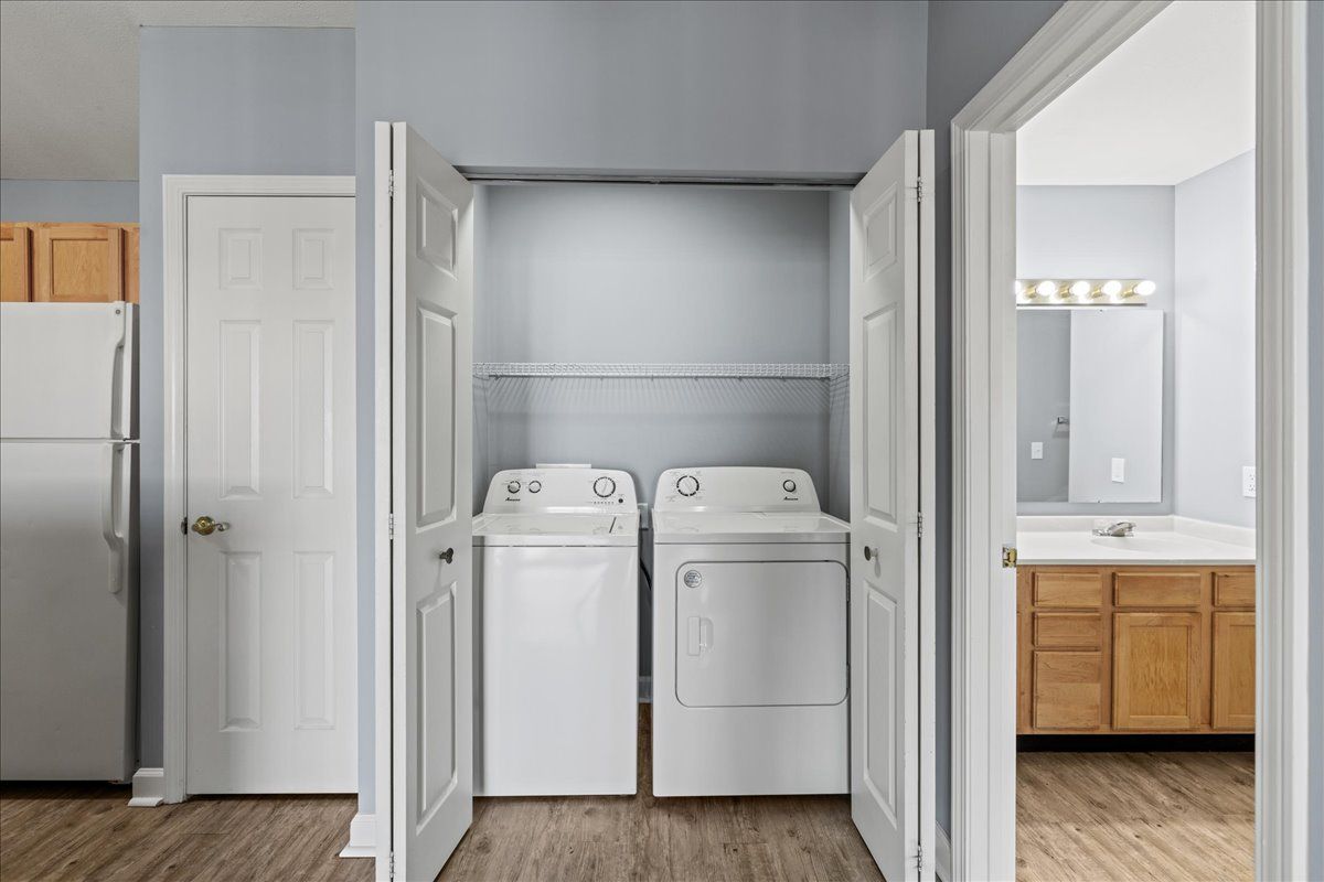 A laundry room with a washer and dryer in a closet.