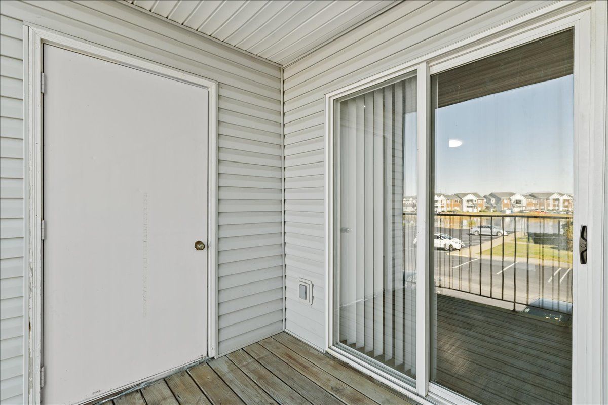 There is a sliding glass door leading to a balcony.