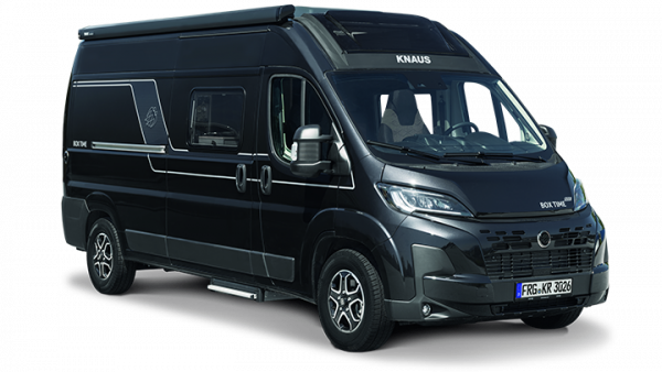 Black camper van parked outdoors.