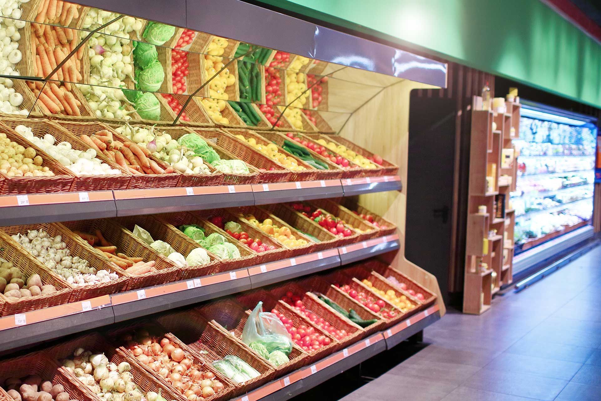 vegetables on the shelves in the supermarket