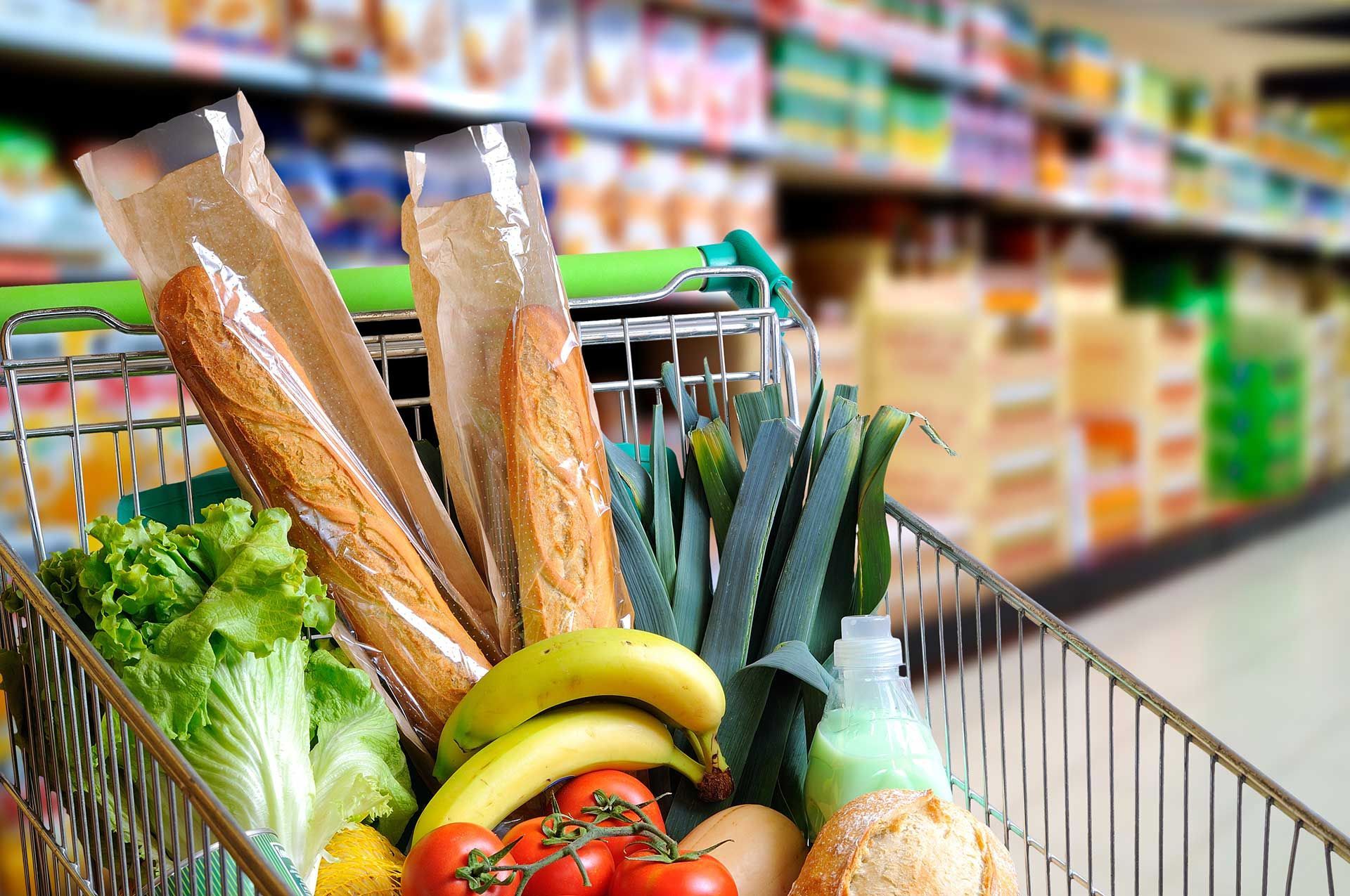 Shopping cart full of food in supermarket