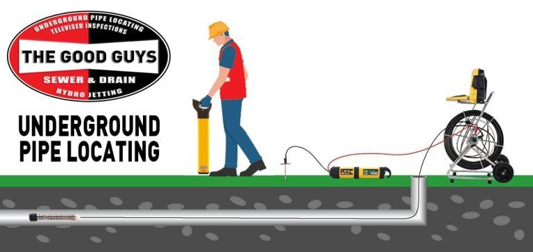 Woman in straw hat smiles, holding wine glass near a lake.