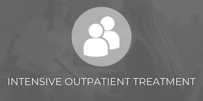 A gray icon of two people above the text