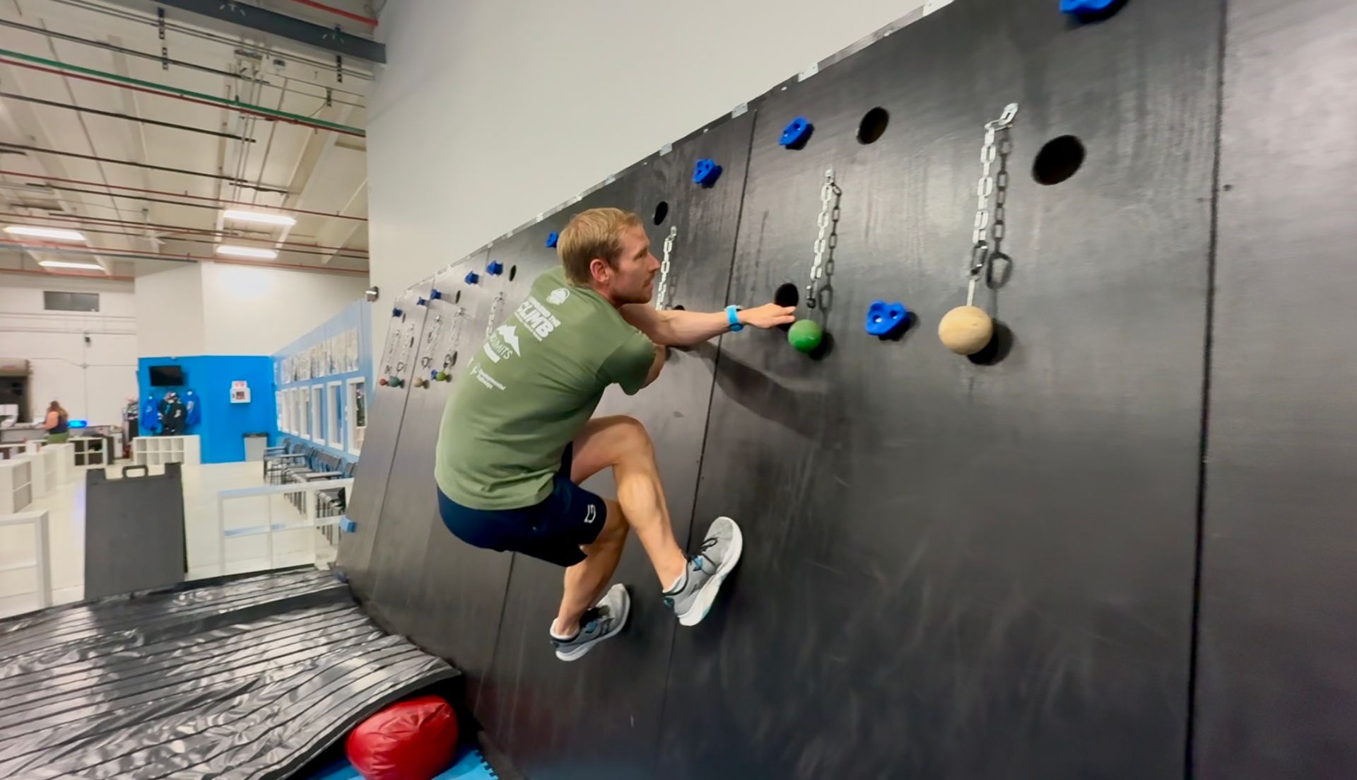 Man traversing the Olympus Wall at Altitude Movement
