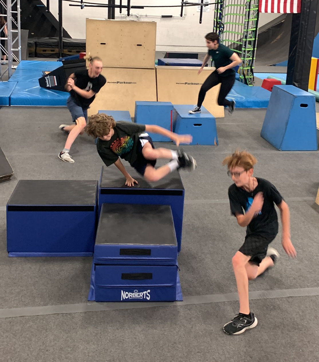 Boys playing tag in the parkour gym