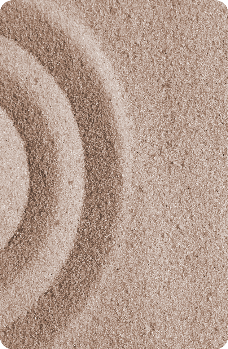 A close up of a pile of sand with a circle in the middle.