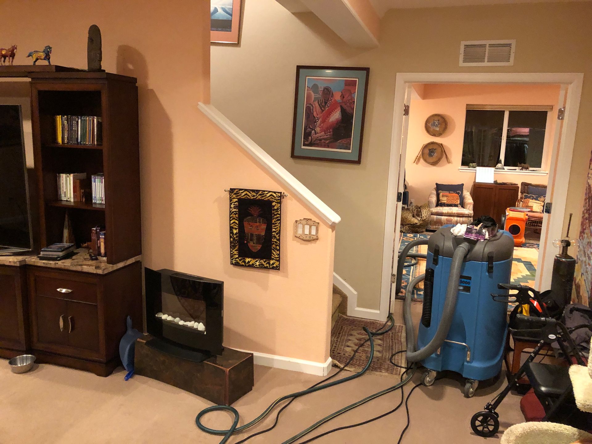 Water extraction and stabilization on CAT2 water damage room.