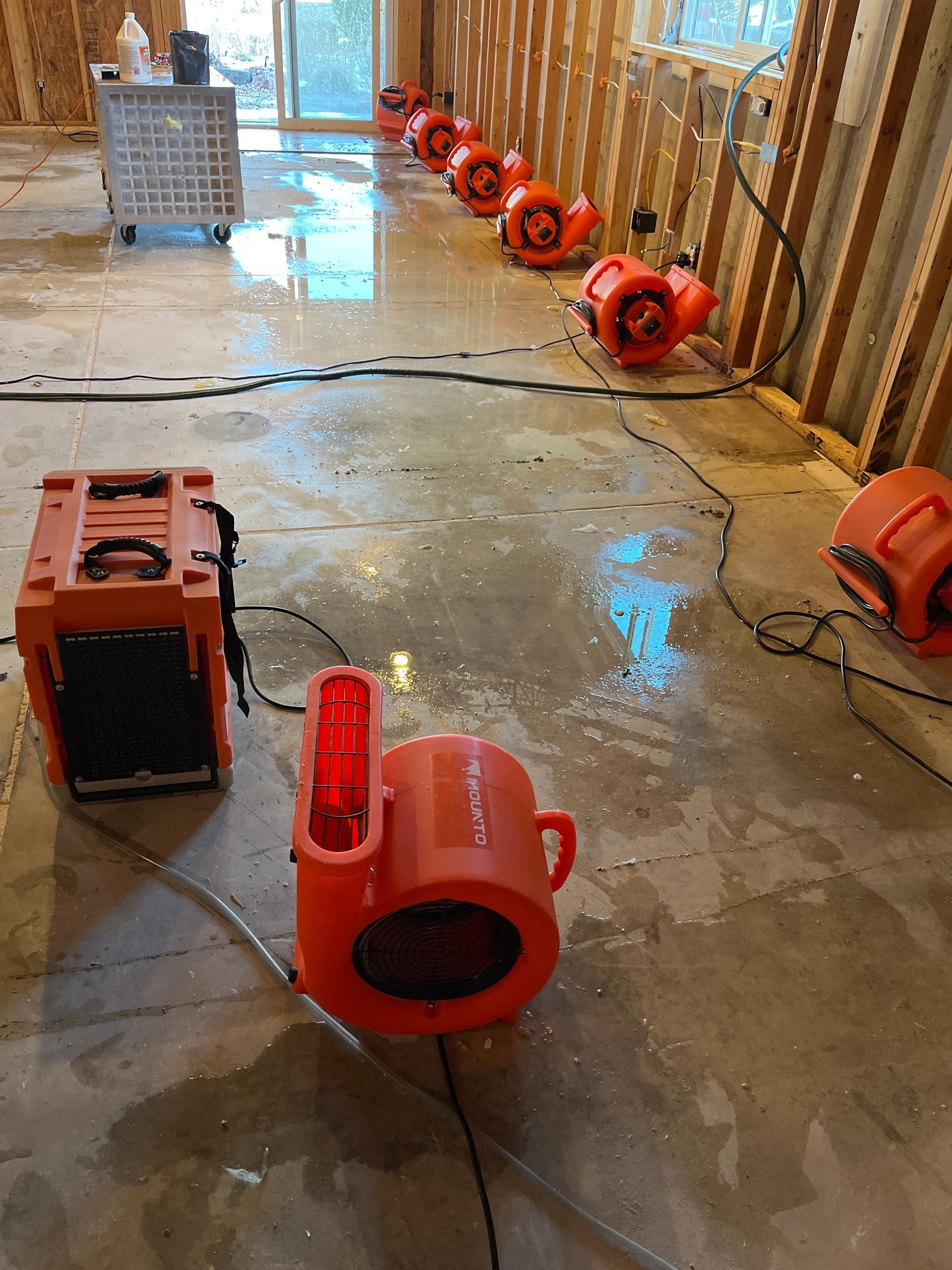 Water damage equipment in action. HEPA air  scrubbers, Dehumidifiers and Air Movers