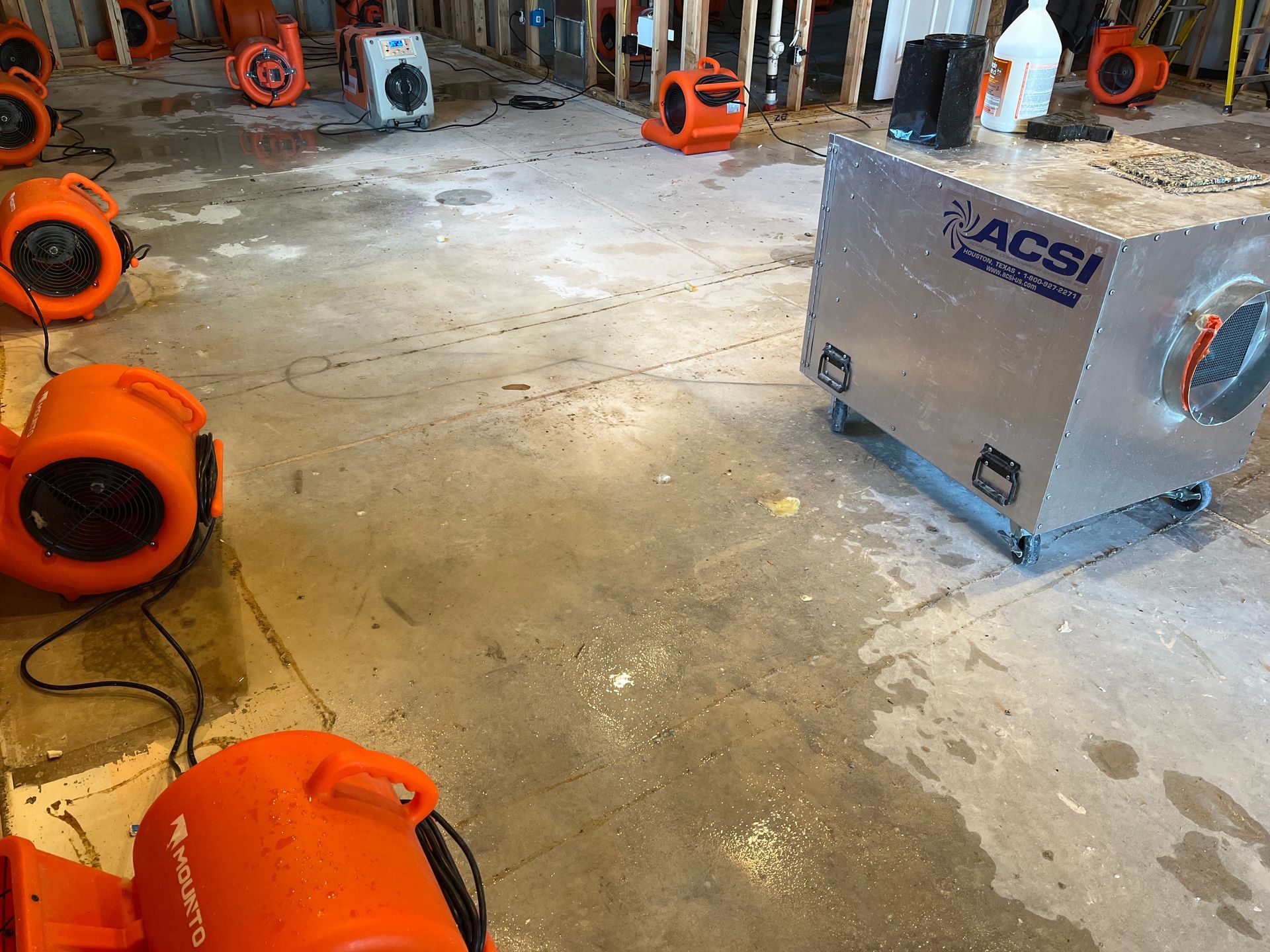 Water damage equipment in action. HEPA air  scrubbers, Dehumidifiers and Air Movers