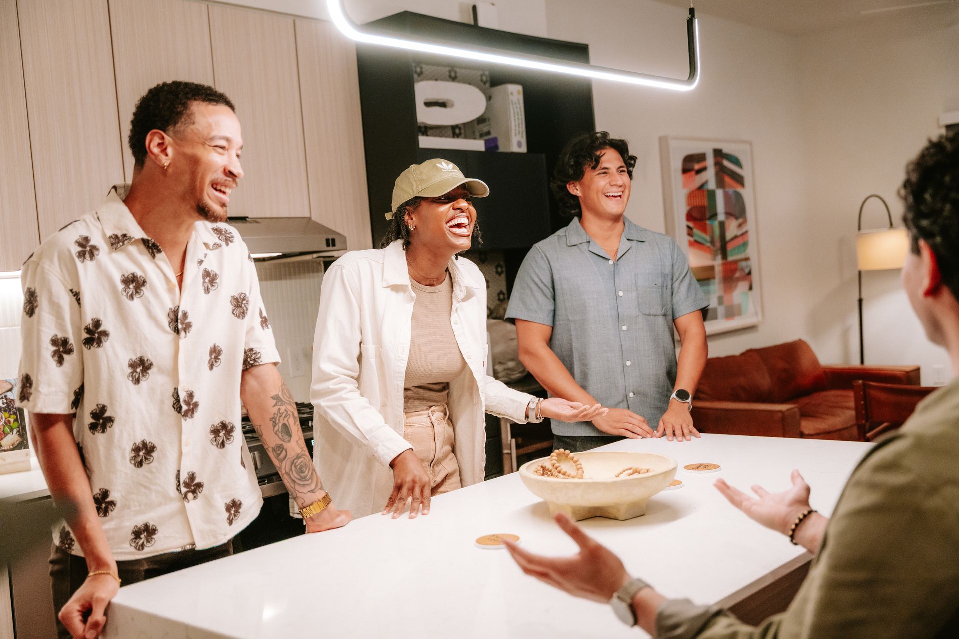 A group of people are standing in a crowd with their arms in the air.