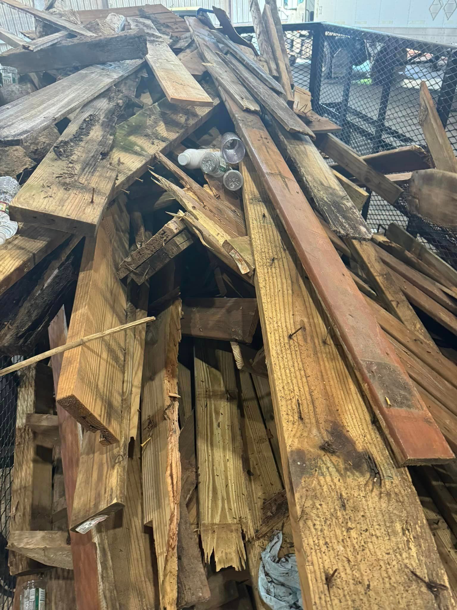 A pile of wood is sitting on top of a pile of wood.