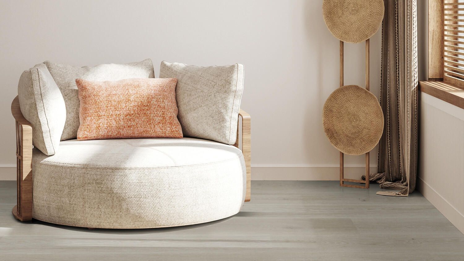 Spóla af grænu garni situr á viðargólfi við hliðina á viskustykki.