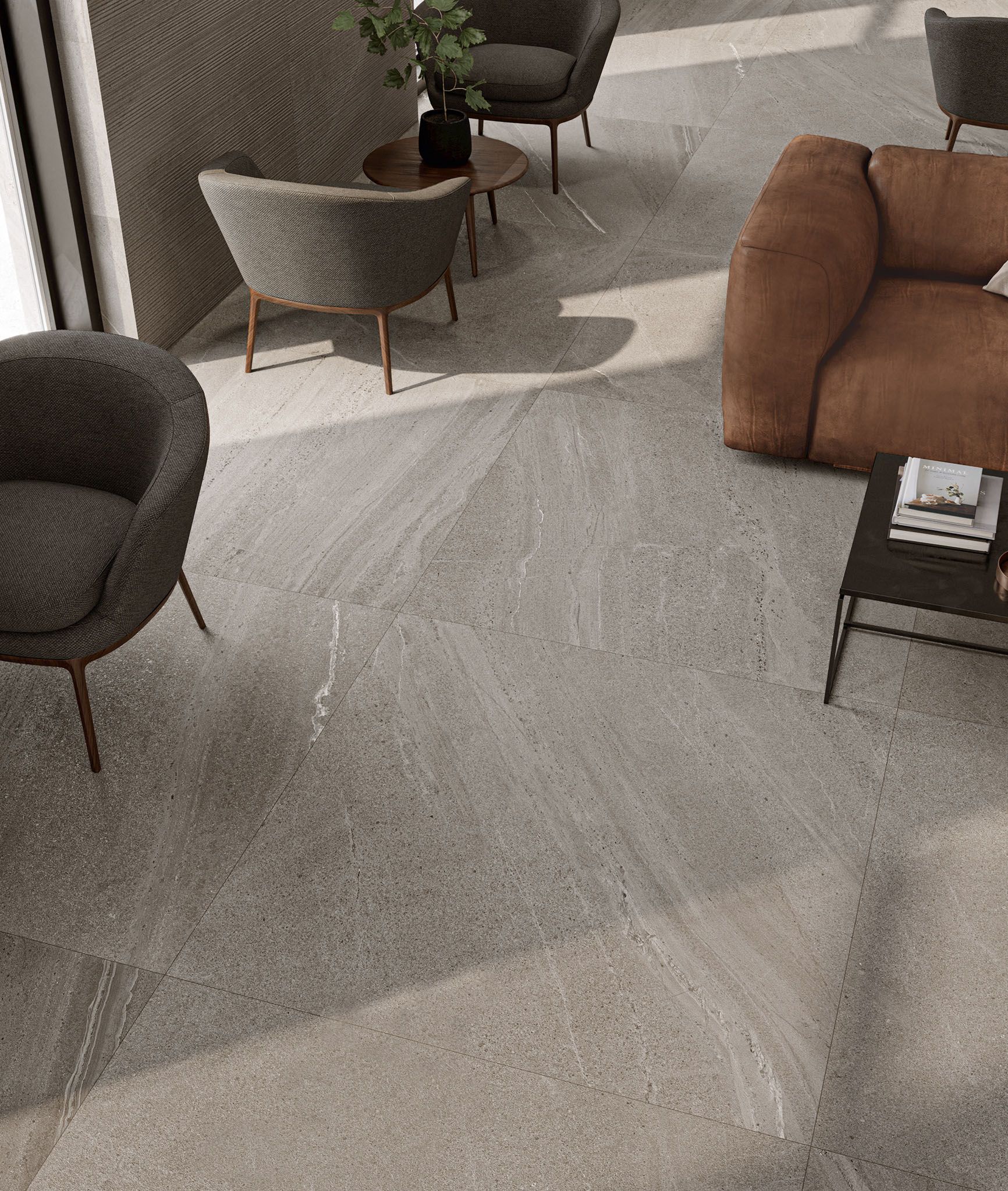 Stofa með sófa, stólum og stofuborði.