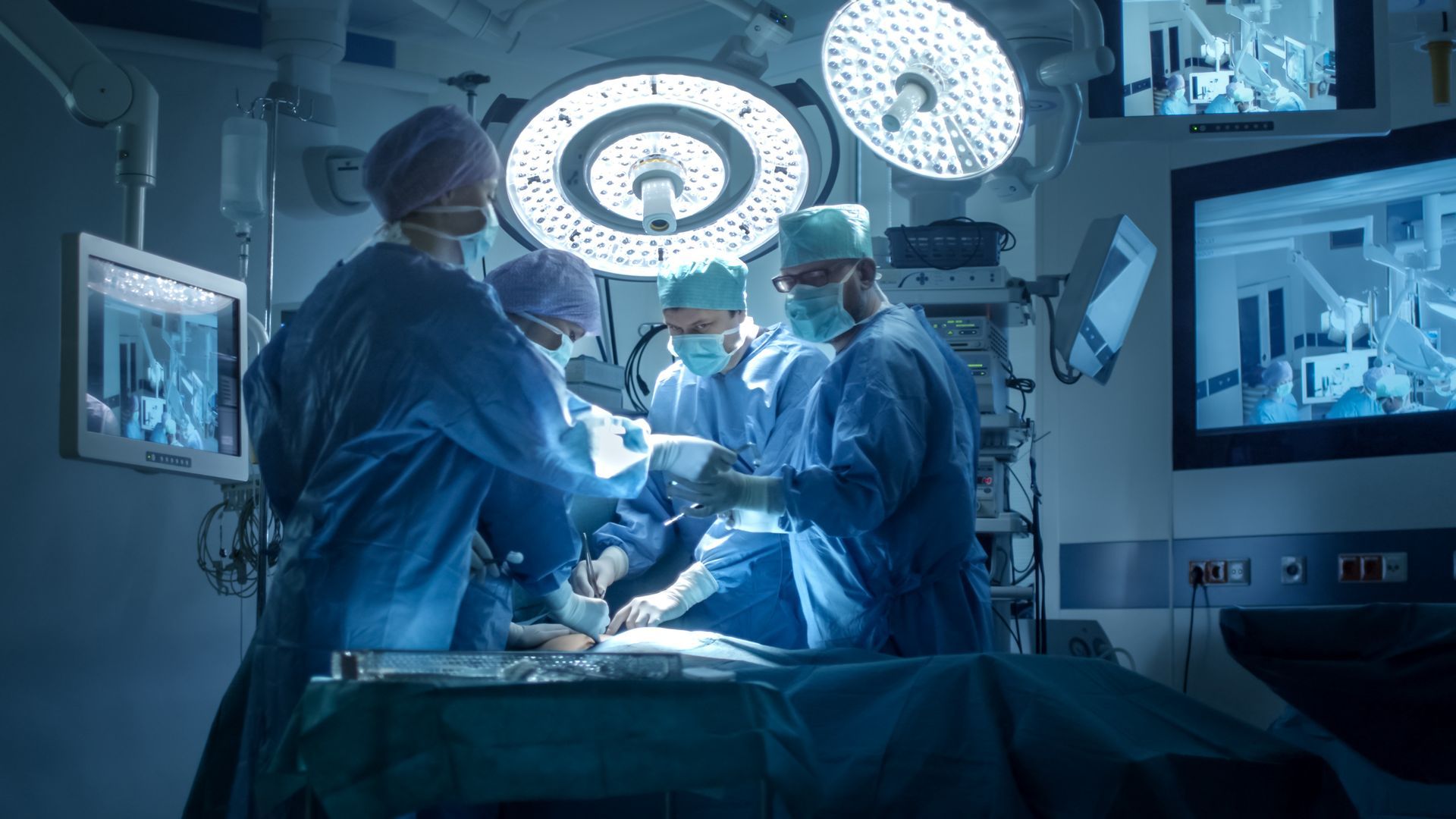 Medical Team Performing Surgical Operation in Modern Operating Room.