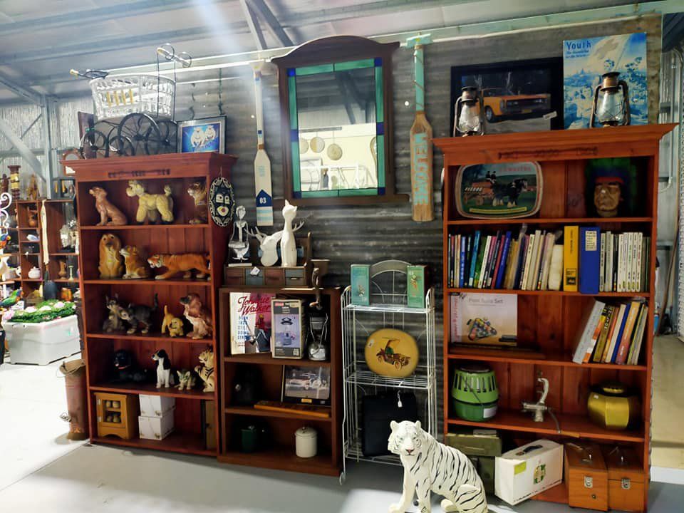 Antique Shop Display With White Tiger And Books — HKL Landscape Supplies In Taree South New South Wales
